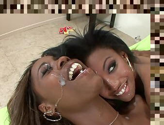 Aroused ebony sluts share cum load in charming modes