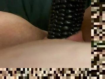 Kinky Milf toying with a black corn cob dildo