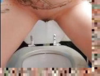 Naughty and kinky wild woman peeing on toilet!