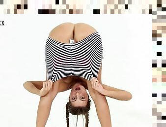 Super cute gymnast does a flexible striptease