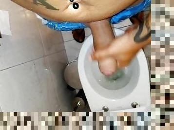 Uncut cock cum in toilet after sun tanning