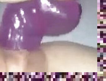 Slave masterbates with giant purple dildo