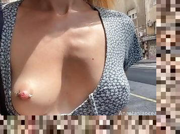 I make passersby happier. Public flashing nipples walk on the city street.