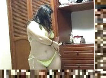 Hot and very pretty chubby woman records herself trying on swimsuits.