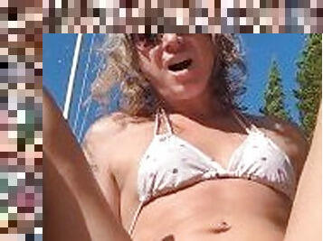 Sexy trans girl using a glass dildo outside deep inside her ass