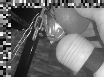 Femdom makes slave cum in chastity cage restrained on the milking table