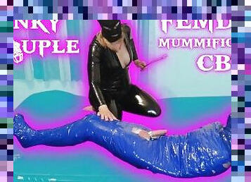 Femdom Goddess whips balls of mummified slave