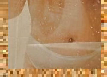 Milf's rubbing her breasts in the shower.