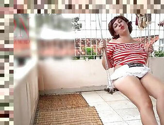A slutty housewife without panties swings on a swing