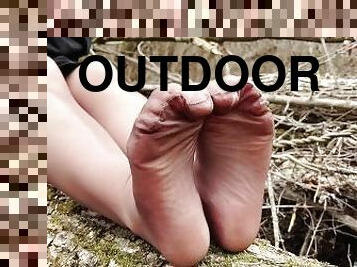Goddess in the spring forest teases you with her feet in tan pantyhose